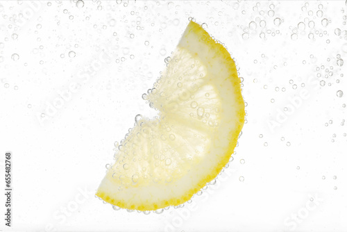 Juicy lemon slice in soda water against white background, closeup