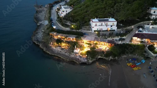 borgo marinaro visto dall'alto di notte sulla costa pugliese del gargano photo