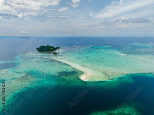 Aerial view of Sandbar and Turtle Island surrounded by azure water and reefs. Barobo, Surigao del Sur. Philippines. photo