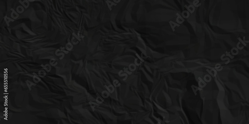 Dark crumple black paper wrinkled poster template ,blank glued creased paper texture background. black paper crumpled backdrop background. used for cardboard and clarkboard.