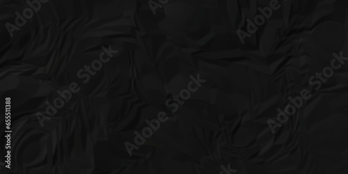 Dark crumple black fabric paper wrinkled poster template ,blank glued creased paper texture background. black paper crumpled backdrop background. used for cardboard and clarkboard.