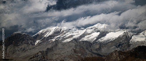 Panorama of mountains during stormy weather photo