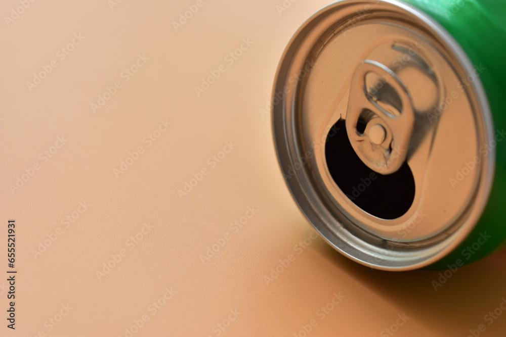 aluminum green drink cans on orange background, open cold fresh beverage aluminum green drink cans on orange background, open cold fresh beverage