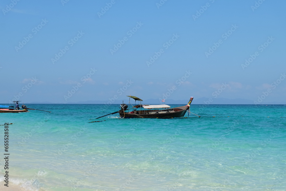 Fishing boat resting at sea on quiet tourist island Fishing boat resting at sea on quiet tourist island