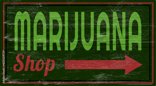 Aged and worn marijuana shop sign on wood