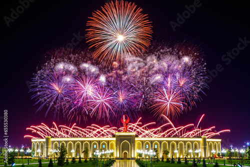 Uzbekistan, Tashkent - September 1, 2023: Multi-colored fireworks over the Independence Monument in Yangi Uzbekistan Park in Tashkent on Independence Day. photo
