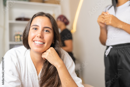 Fototapeta Naklejka Na Ścianę i Meble -  Happy woman in a beauty salon ready for a massage