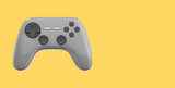 Realistic console game controller. Gray icon on yellow background with space for text. 3D rendering.