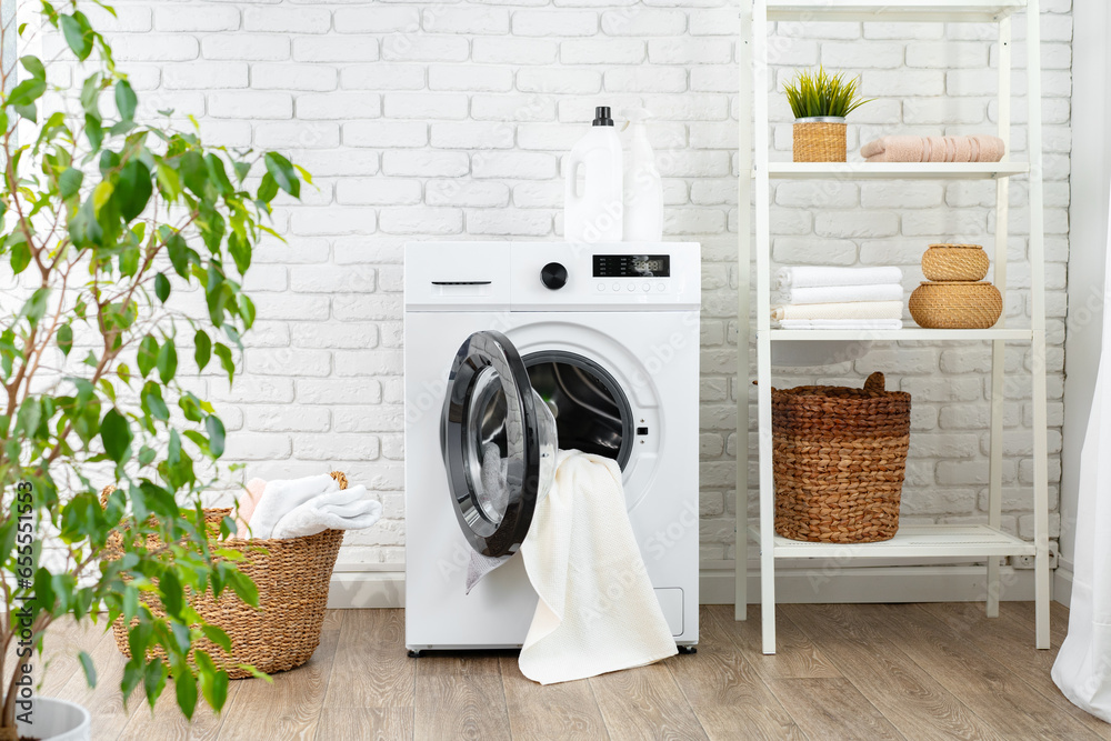 Washing machine and basket in a laundry room Washing machine and basket in a laundry room