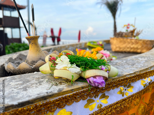 Canang Sari , Offering for pray at Bali Kuta beach, 
Indonesia photo