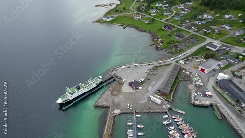 Circling over the Harbor of Botnhamn with the Ferry inside the Port and long line of vehicles photo