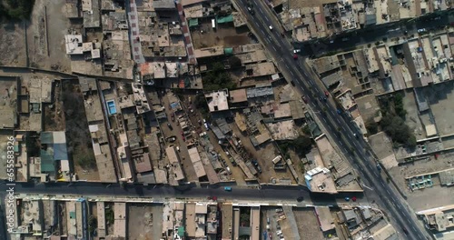 Aerial birds eye shot above the streets of Huacho city, sunny day in Peru photo