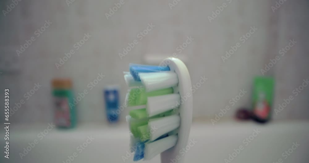 Close-up of toothbrush in bathroom. Brushing teeth morning daily procedures. High quality 4k footage