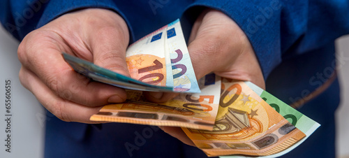 Female hands counting large amount EU euro money photo