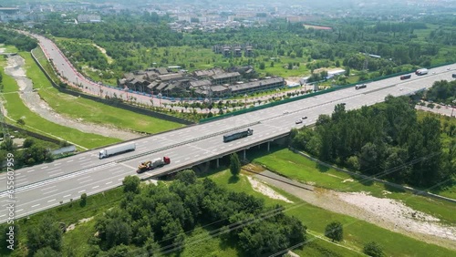 Aerial of Lianhuo Expressway highway, Huayin, Shaanxi, China. This modern roadway exemplifies China's commitment to infrastructure development and efficient connectivity, UHD. photo