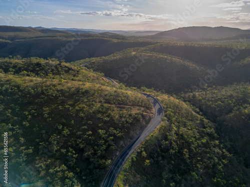 Aerial view of tropical remote road in Far North Queensland with a sunset © AspectDrones