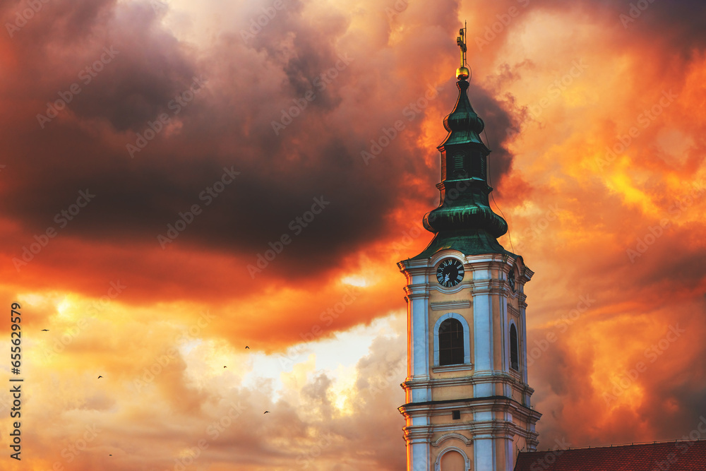 Dormition church tower in Novi Sad, Serbia. Beautiful orthodox religious building in summer sunset.