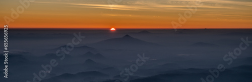Hazy landscape at sunset time. View from Jested Mountain, Liberec, Czech Republic