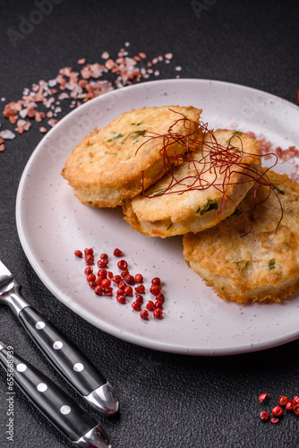 Delicious fried minced fish cutlets or meatballs with salt, spices and herbs