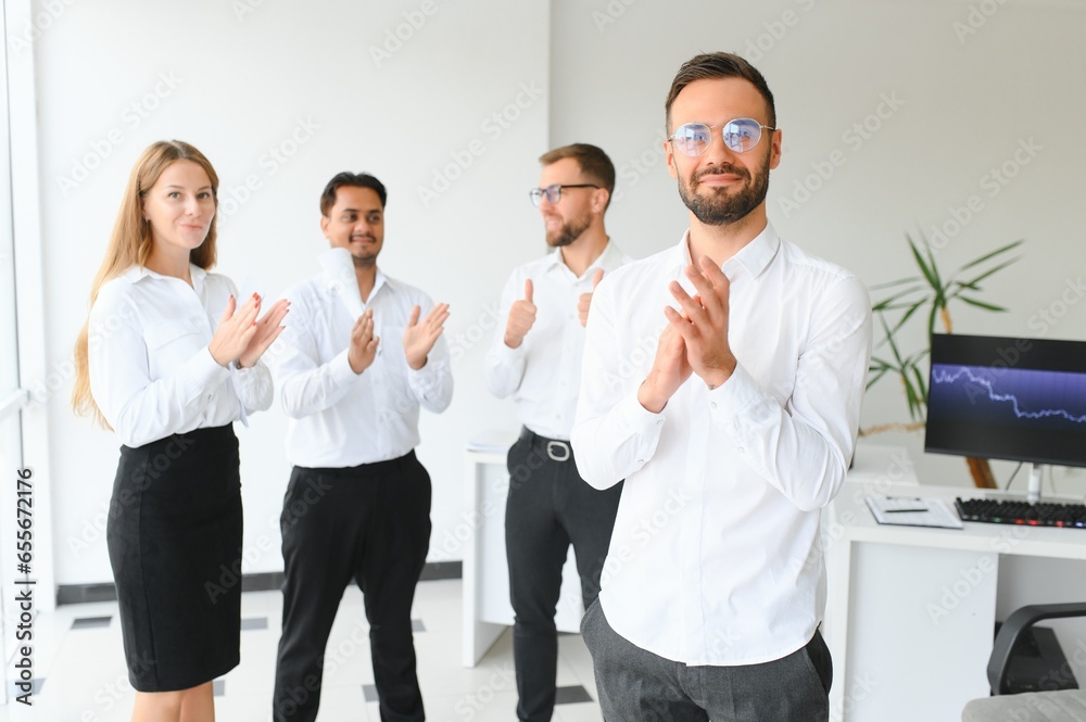 Business people stand on the background of the office corridor