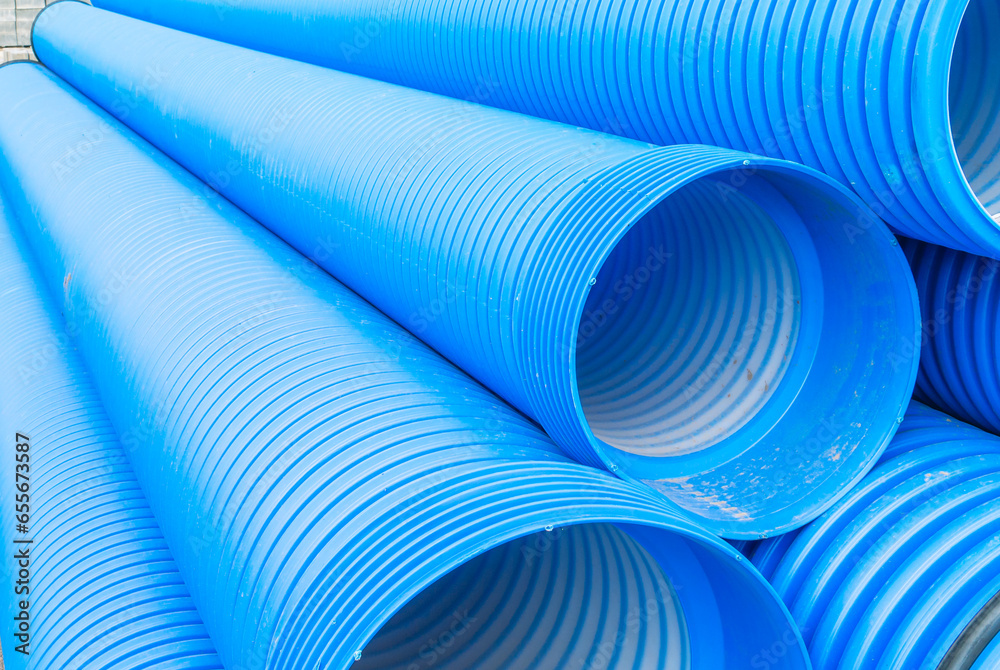 Blue plastic drain pipe with thread. Corrugated sewer pipes of large