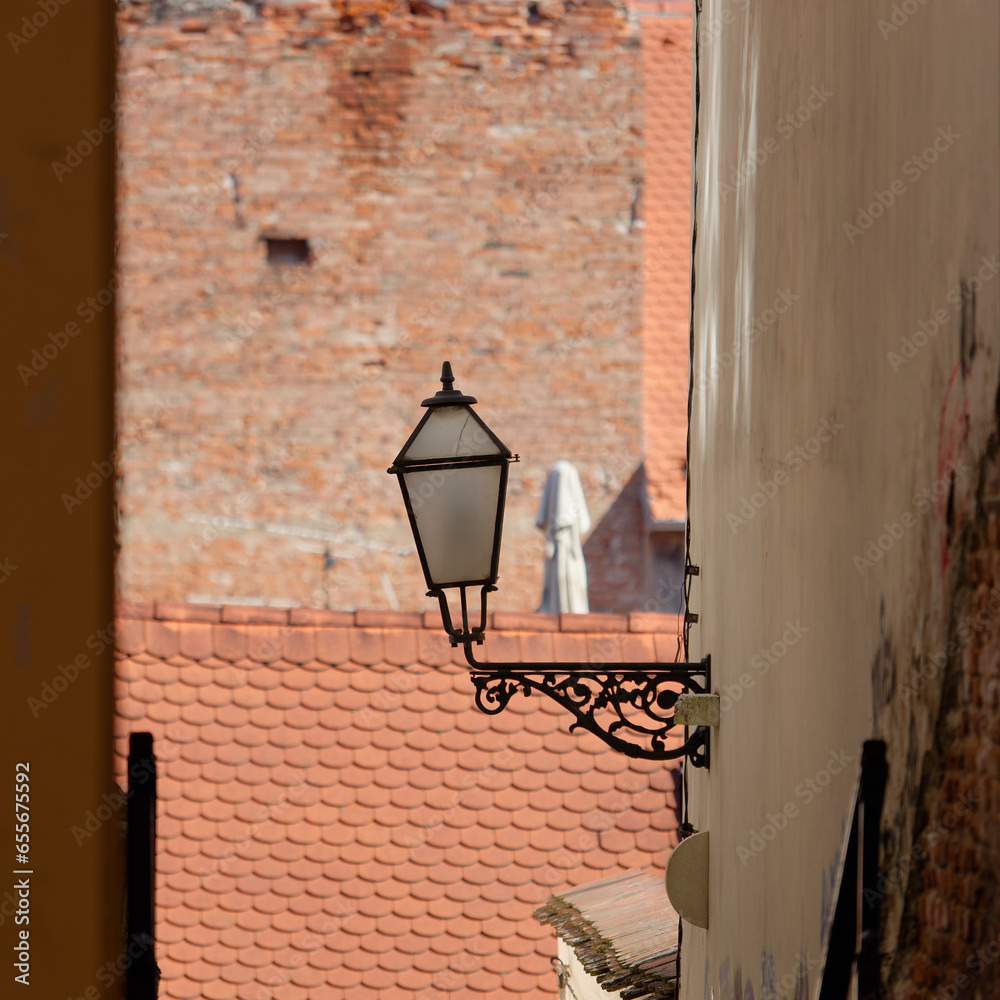 Selective focus photo of a vintage street lamp above stairs in the Upper Town of Zagreb, Croatia