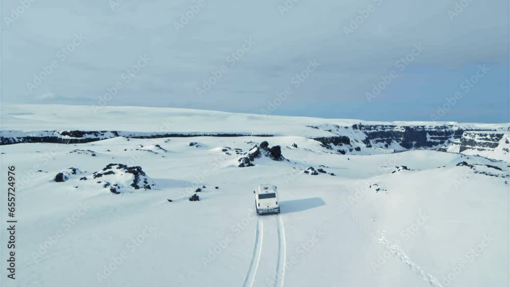 Driving Through Snowy Wasteland In Iceland - Drone Shot Driving Through Snowy Wasteland In Iceland - Drone Shot