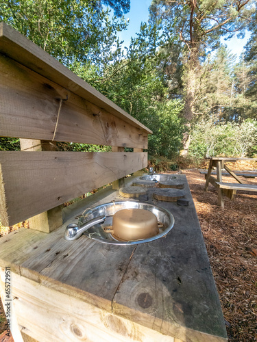 Children outdoor mud kitchen in a forest in County Donegal - Ireland