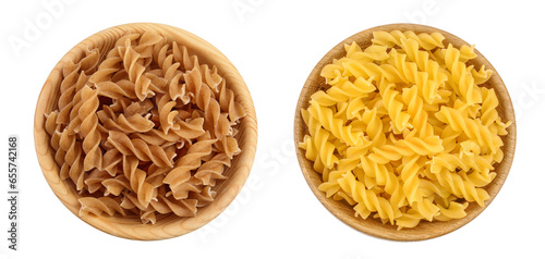 Wolegrain fusilli pasta from durum wheat in wooden bowl isolated on white background with full depth of field. Top view. Flat lay.