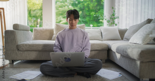 Photography Focused South Korean Professional Enjoying Telecommuting, Working on His Laptop