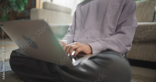 Close Up of a Male Working from Home, Using Laptop Computer to Optimize Performance and Achieve Goals, Creating Engaging Content and Managing Social Media Campaigns from a Remote Home Workspace