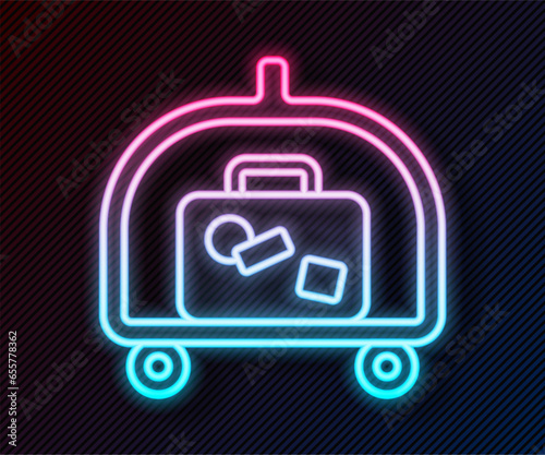 Glowing neon line Hotel luggage cart with suitcase icon isolated on black background. Traveling baggage sign. Travel luggage icon. Vector