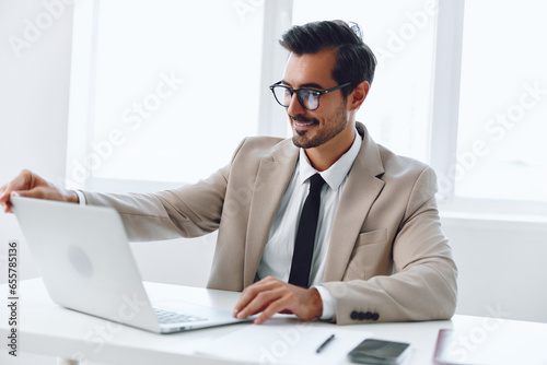 Man laptop happy businessman worker winner business suit office background job technology white