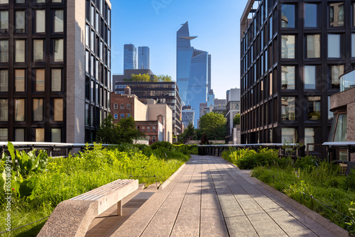 The High Line promenade with Hudson Yards skyscrapers. Elevated greenway park in Chelsea, Manhattan, New York City photo