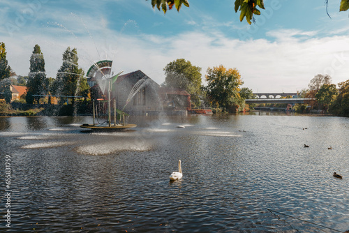 City fountain and pond with swan and ducks in Old European City Bietigheim-Bissingen In Germany. the City Park of Bietigheim-Bissingen, Baden-Wuerttemberg, Germany, Europe. Autumn Park and nature