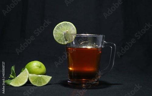 Tasty Lemon tea with mint leaf and sliced green
lemon