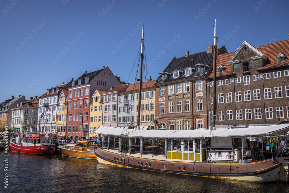 Colourful buildings, and boats, along Nyhavn, Copenhagen, Denmark