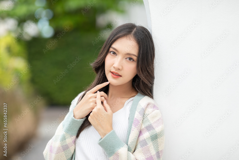 Beautiful asian young woman smile and cheerful. Confident cute female looking at camera relax and happiness with wellness life. good moment and positive emotional. Happy woman enjoy her life concept Beautiful asian young woman smile and cheerful. Confident cute female looking at camera relax and happiness with wellness life. good moment and positive emotional. Happy woman enjoy her life concept