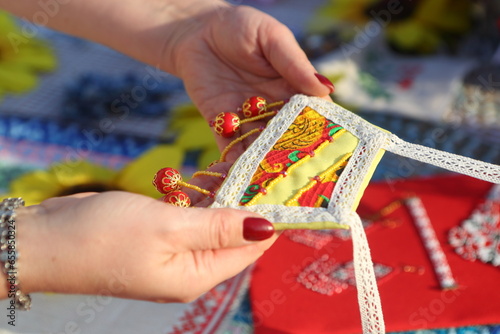 Hands holding a handmade product. photo