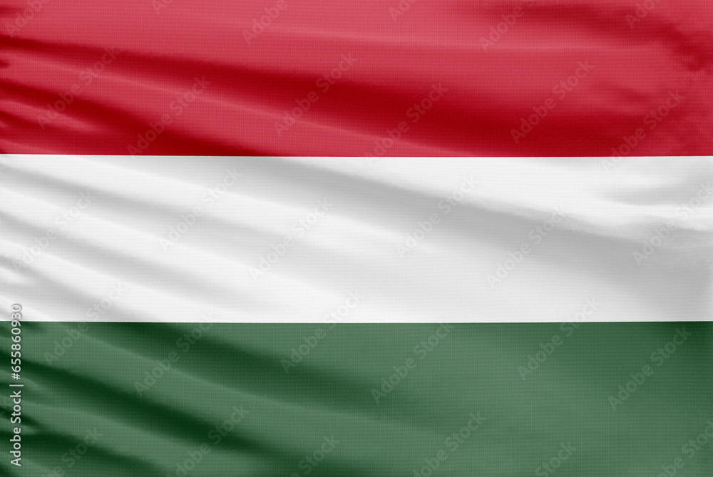 Hungary flag is depicted on a sport stitch cloth fabric with folds. Hungary flag is depicted on a sport stitch cloth fabric with folds.