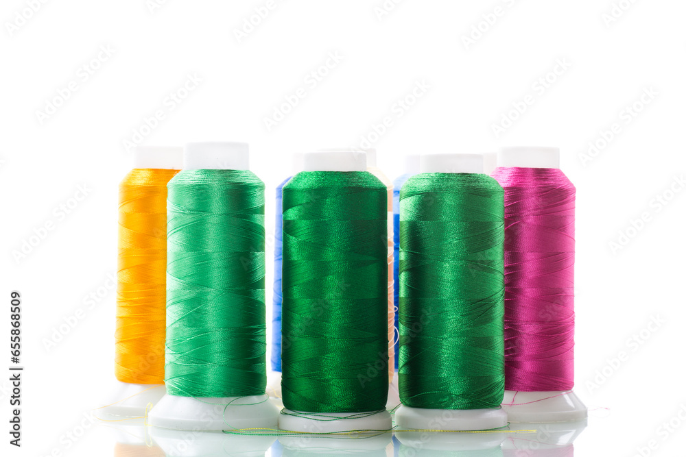 set of different color sewing threads,on white background. set of different color sewing threads,on white background.
