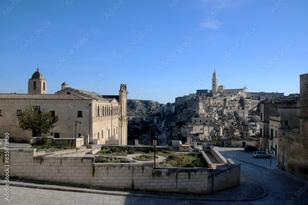 A breathtaking panoramic view of Matera's captivating Sassi, an ancient Italian district carved into the rocks, showcasing historic architecture and centuries-old caves. UNESCO World Heritage.