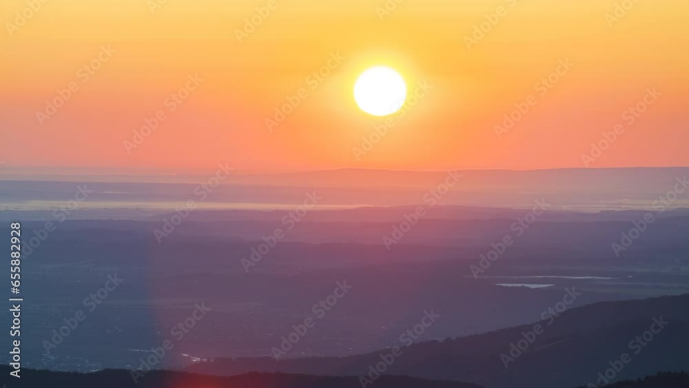 Timelapse of amazing mountain landscape. Bright colorful sunset in wild national park highlands. Dark spruce woods illuminated with yellow setting sun Timelapse of amazing mountain landscape. Bright colorful sunset in wild national park highlands. Dark spruce woods illuminated with yellow setting sun