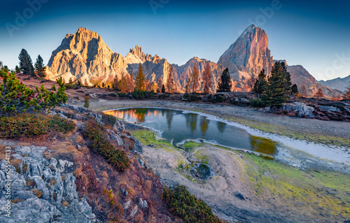 Wonderful morning view of frozen Limides lake. Spectacular autumn landscape of Dolomite Alps. Superb outdoor scene of Falzarego pass, Italy, Europe. Beauty of nature concept background.