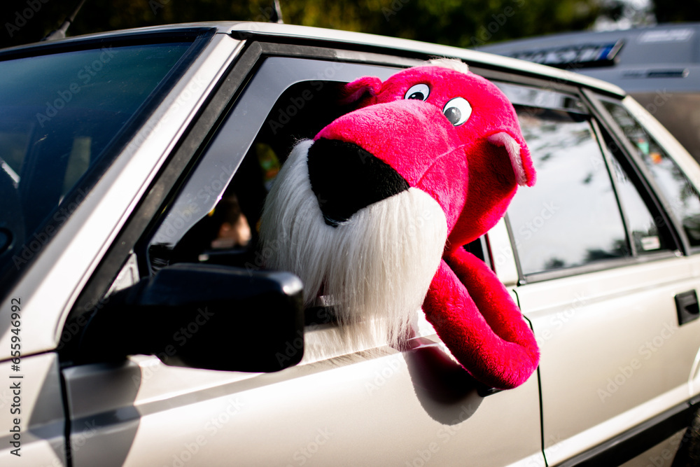pink panther driving a car