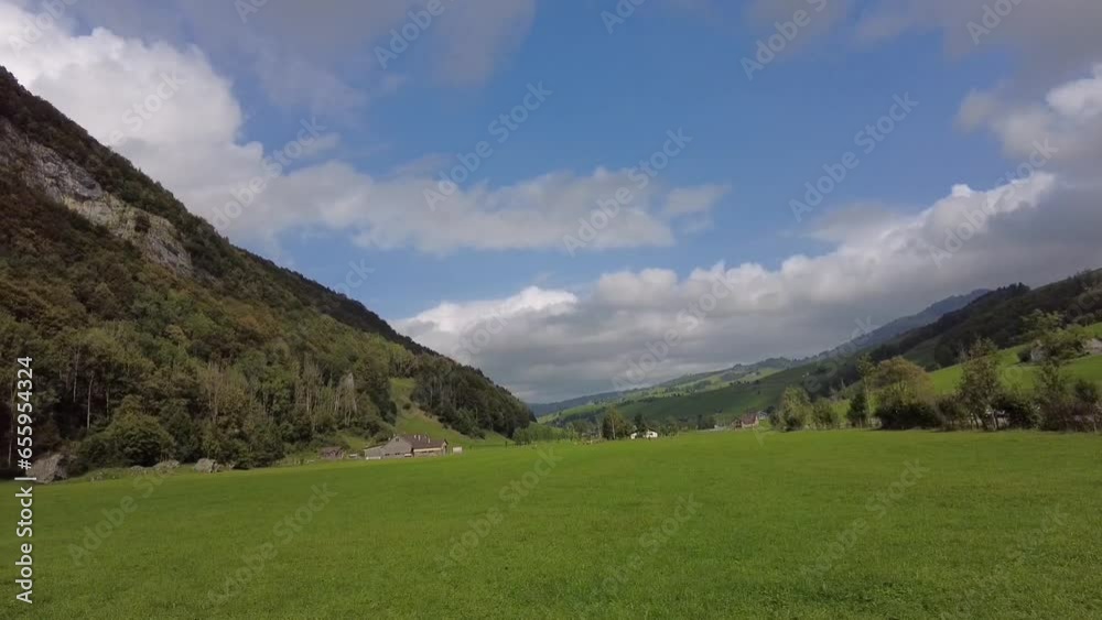 Wassernauen, Switzerland - 30. September 2023: The red cable car of Ebenalp is ascending to the top of Ebenalp peak - a popular outdoor activitiy paradise for hiking and parachuting. Wassernauen, Switzerland - 30. September 2023: The red cable car of Ebenalp is ascending to the top of Ebenalp peak - a popular outdoor activitiy paradise for hiking and parachuting.