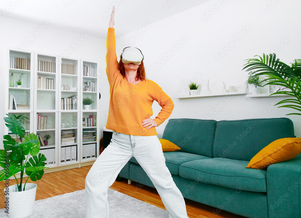 woman playing VR glasses. Sport in virtual reality. The concept of metaverse, virtual reality, future, technology and internet of things.