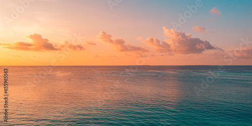 Aerial panoramic view of sunset over ocean. Colorful sky clouds water. Beautiful serene scene, wide angle seascape. Drone view, majestic stunning nature background. Best sea sky sunrise. Inspire views
