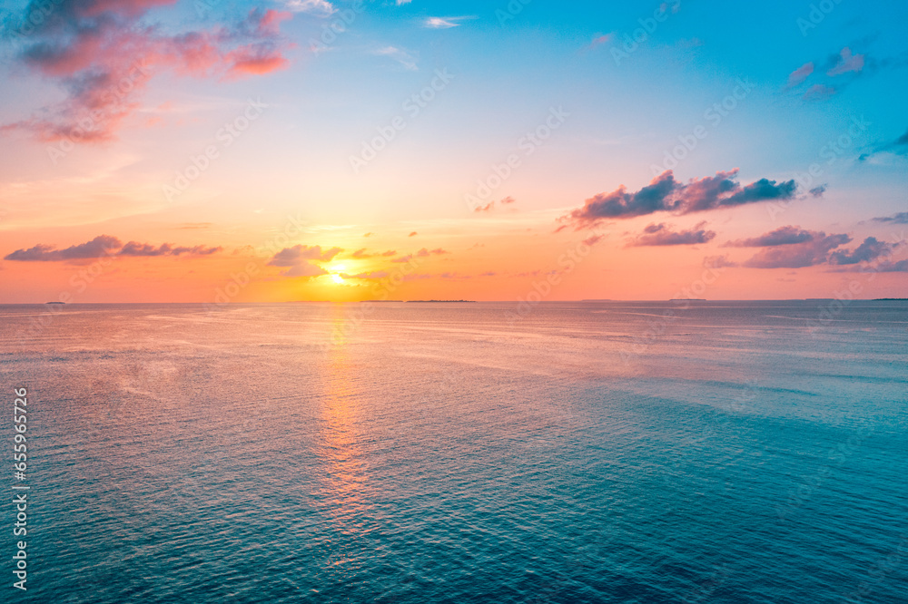 Aerial view sunset sea sky. Nature beautiful light sunrise over horizon. Colorful dramatic majestic seascape. Amazing sunlight clouds waves in sky purple blue light background. Stunning best views