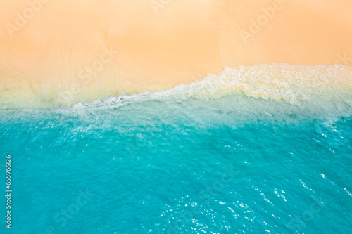 Top drone view fantastic popular travel landscape. Summer seascape blue water yellow sand. Aerial amazing tropical nature background. Beautiful mediterranean bright sea waves crash beach sunlight